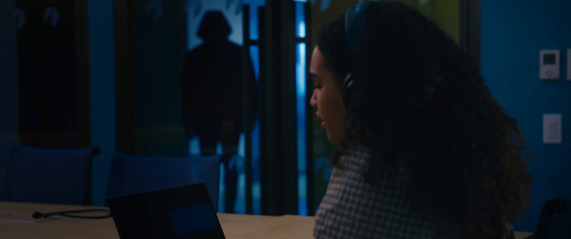 A shadowy figure in the doorway behind a student working late, from Don't Ghost Your Future