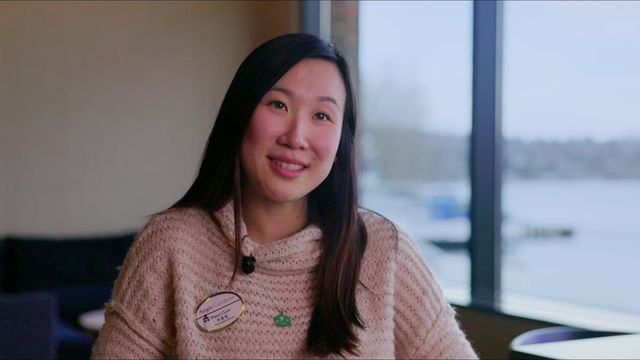 Aegis Living team member interviewed by a window